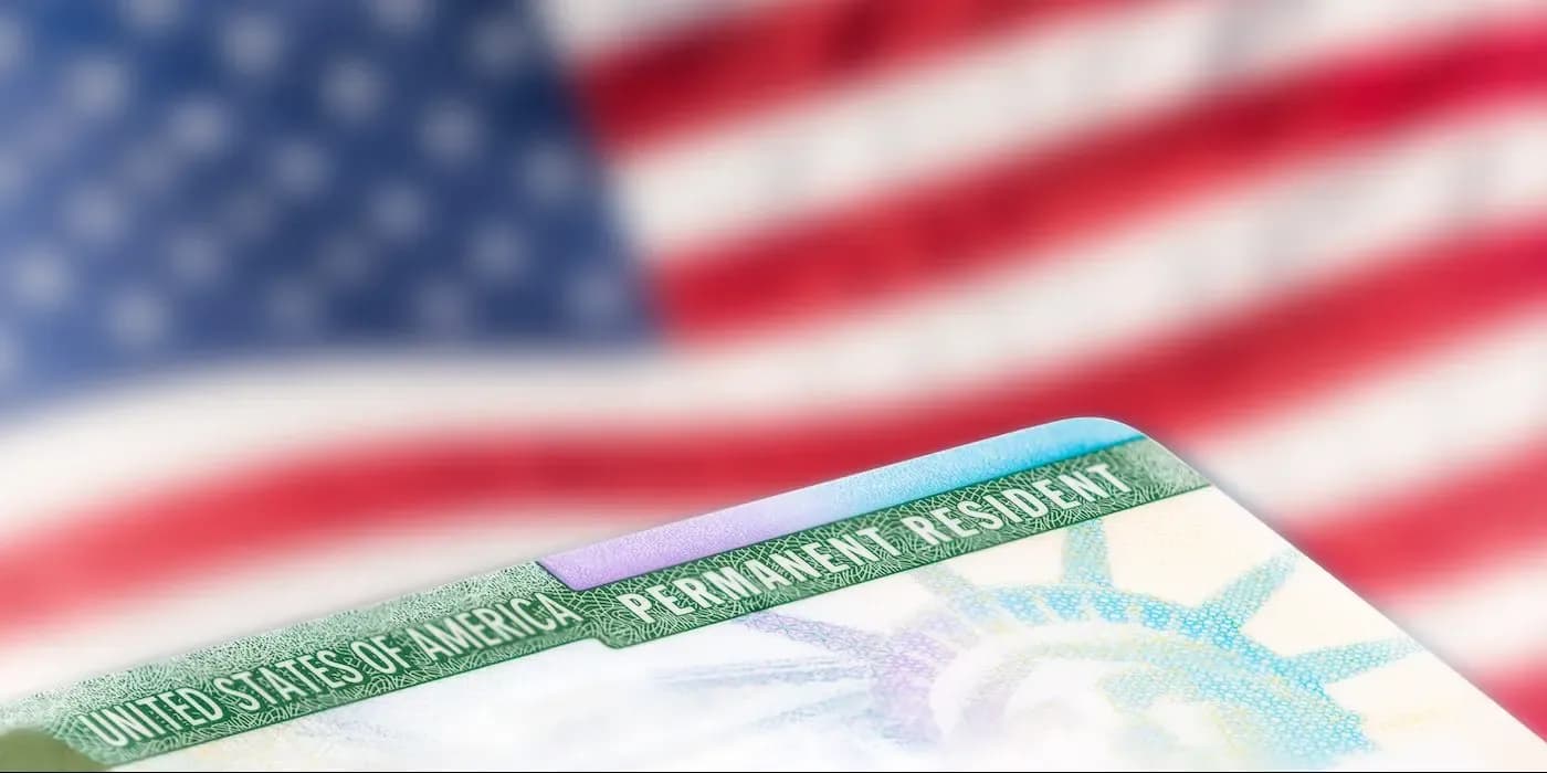 US passport with American flag in background symbolizing immigration and citizenship