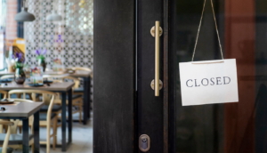 Closed sign on a restaurant's door.